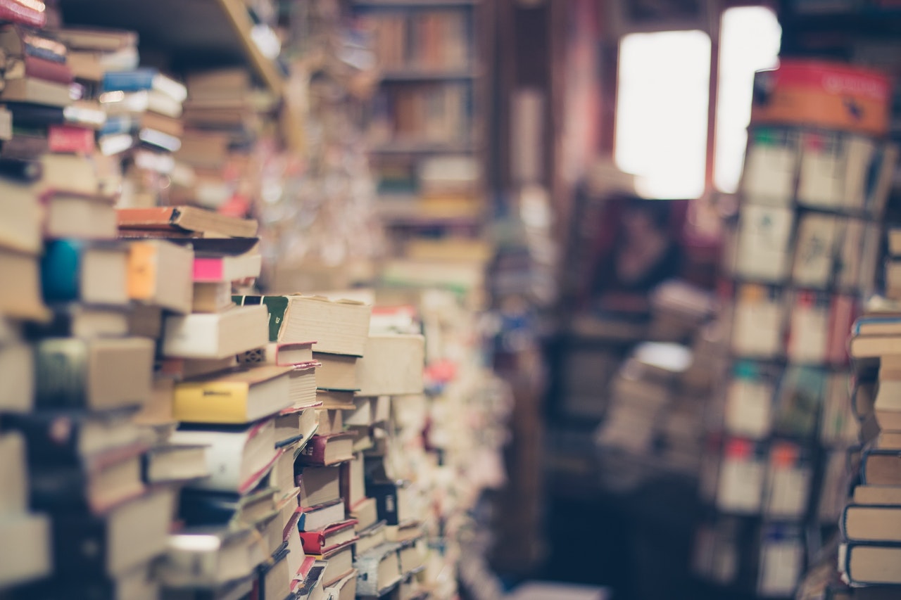 Figure half-lost in book stacks